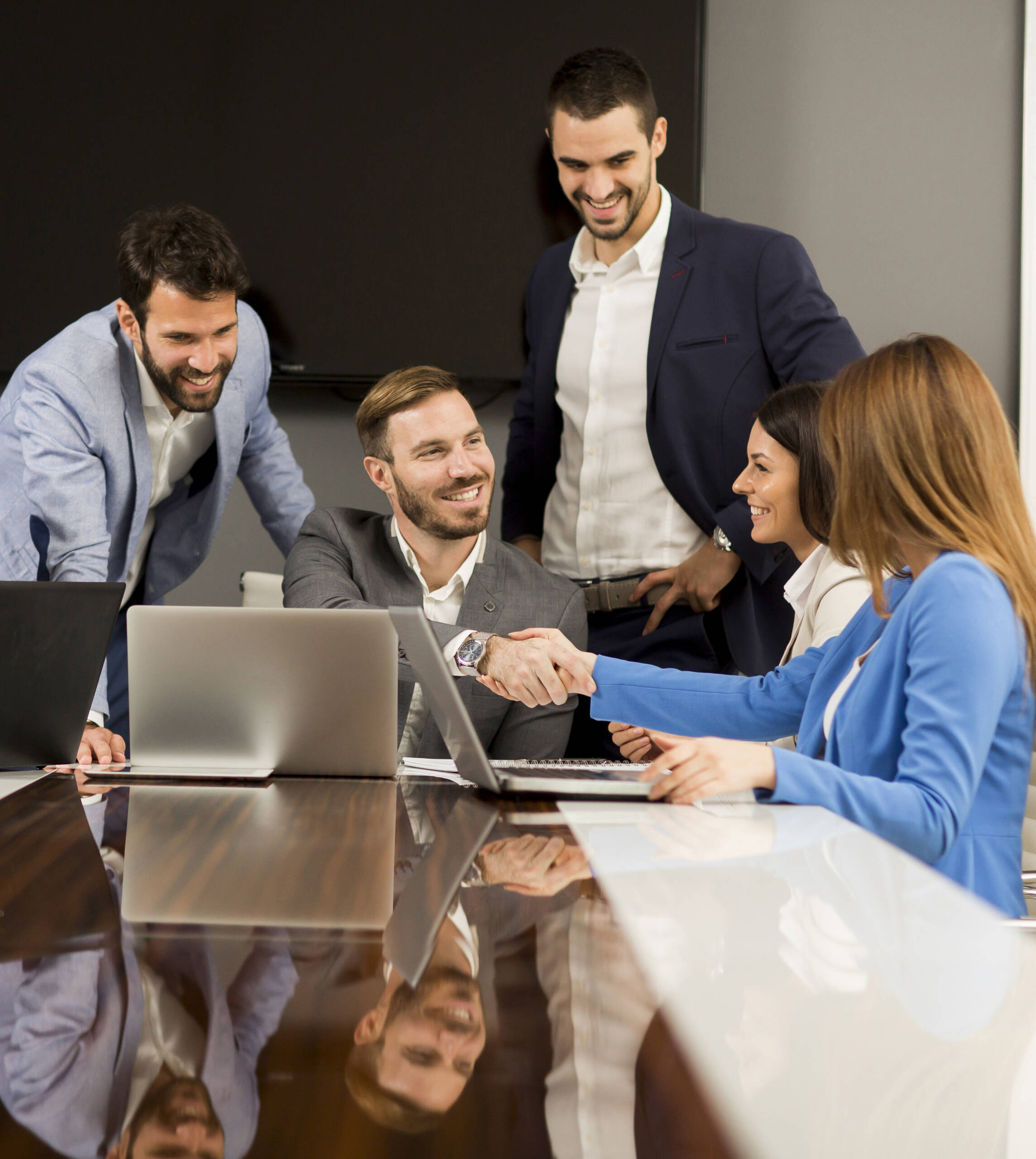 Young teamwork by the table in the office